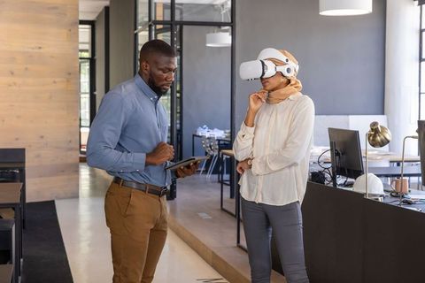 Diverse Coworkers Engaging with Virtual Reality in Open-Plan Office