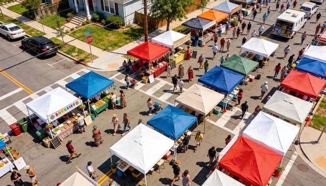 Aerial market scene with colorful canopies and shoppers browsing street festival vendors