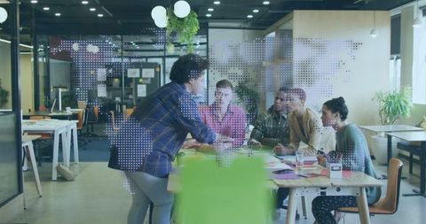 Dynamic Team Meeting in Modern Open-plan Office Environment