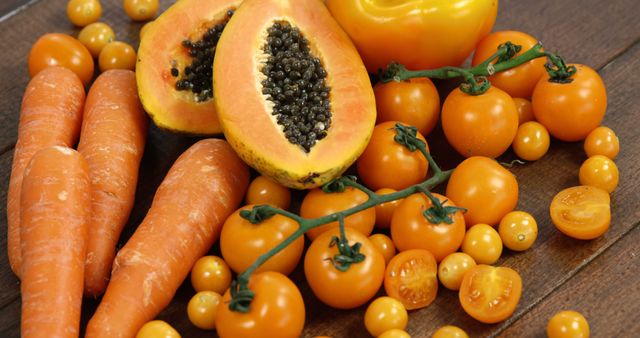 Assortment of Fresh Orange Vegetables and Fruits on Wooden Surface - Download Free Stock Images Pikwizard.com