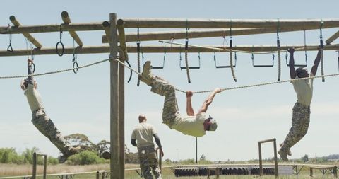 Soldiers training on military obstacle course outdoors
