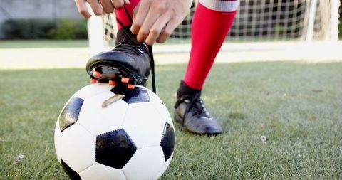 Teen Sports Enthusiast Preparing for Football Match