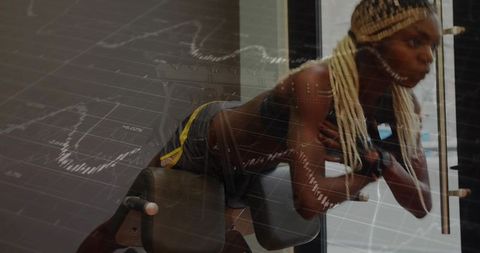 Female athlete doing back extension on roman chair with financial chart overlay in gym