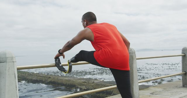 Athlete with Prosthetic Leg Stretching Near Ocean - Download Free Stock Images Pikwizard.com