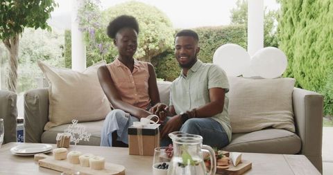 Happy Couple Enjoying Outdoor Gift Exchange