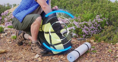 Male Hiker Exploring Nature Wilderness by Backpacking in Rugged Terrain