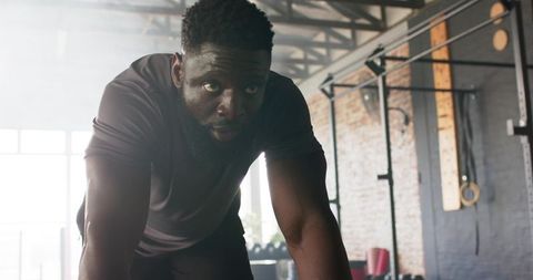 Athlete cooling down in modern gym moment of reflection