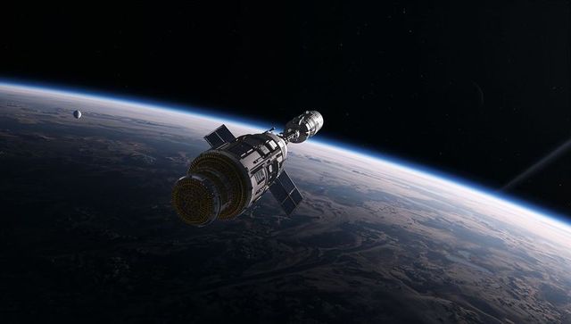 Spacecraft with Solar Panels Orbiting Earth with Moon View