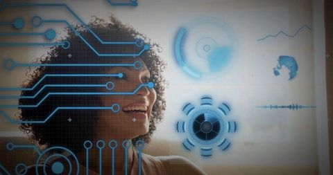 Smiling curly-haired woman viewing holographic HUD interface at home for futuristic tech