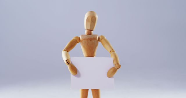 Wooden Mannequin Holding Blank Card On Light Background - Download Free Stock Images Pikwizard.com