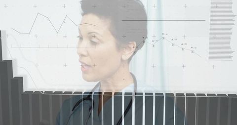 Mature clinician analyzing healthcare data dashboards with stethoscope overlay
