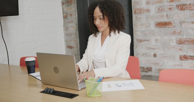 Businesswoman Working on Laptop in Office - Download Free Stock Images Pikwizard.com