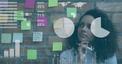 Businesswoman Analyzing Data on Brick Wall with Sticky Notes and Charts