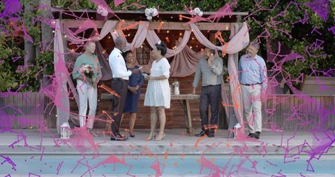 Couple exchanging vows under draped pergola at dusk backyard poolside wedding celebration