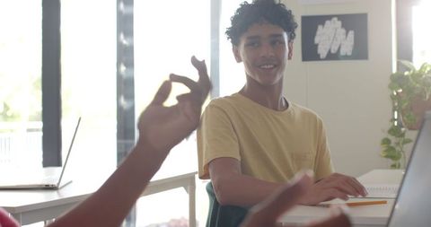 Teenage Student Engaged in Classroom Discussion
