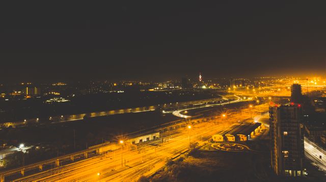 Urban Nightscape with Illuminated Streets and Buildings - Download Free Stock Images Pikwizard.com