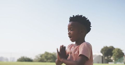 Boy Practicing Mindfulness in Sunny Park Landscape