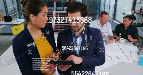 Collaborating professionals analyzing ar data on tablet over architectural blueprints