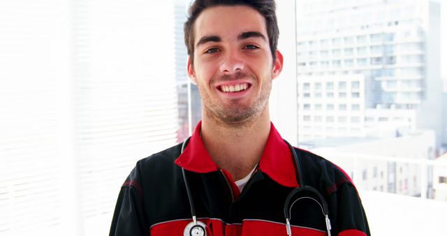 Smiling Male Paramedic with Stethoscope in Urban Setting - Download Free Stock Images Pikwizard.com