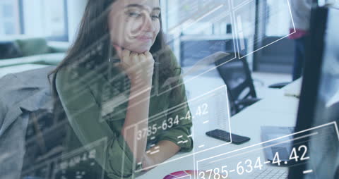 Businesswoman Analyzing Data with Futuristic Interface in Office