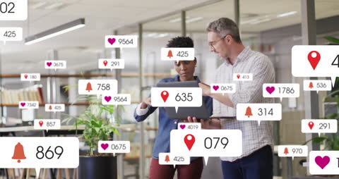 Diverse Coworkers Analyzing Digital Notifications on Laptop