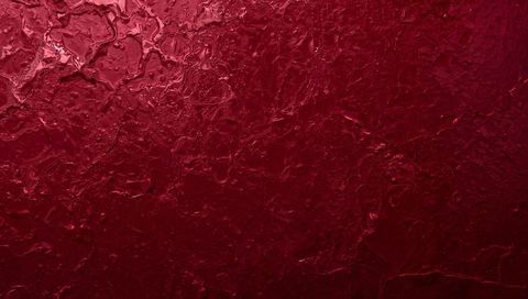 Displaying deep red textured plaster with glossy brush strokes, raised ridges and tactile relief