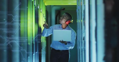 it technician managing data servers with digital overlay - Download Free Stock Images Pikwizard.com