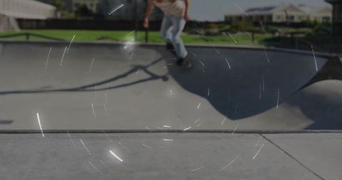 Skateboarder carving bowl with urban background