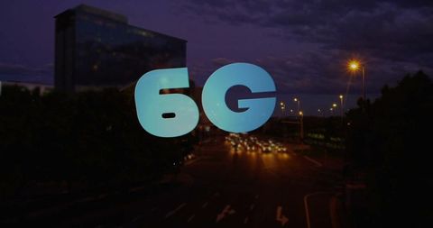 Neon 6g graphic over city road at night