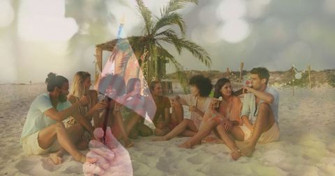 Friends Enjoying Beach Gathering with Drinks at Sunset