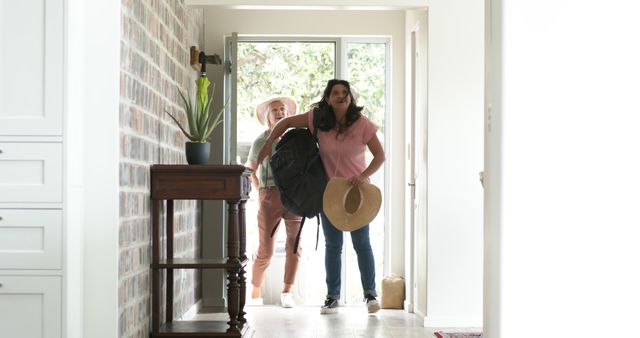 Happy Women Returning Home from Vacation with Luggage - Download Free Stock Images Pikwizard.com