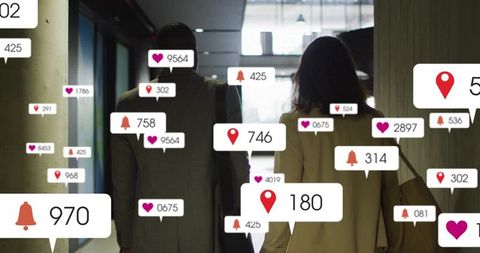 Walking coworkers in modern office corridor with floating social media notification badges
