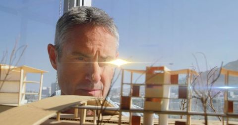 Architect planning innovative building design with intriguing lens flare