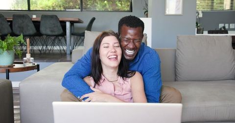 Happy Mixed Race Couple Announcing Engagement on Video Call