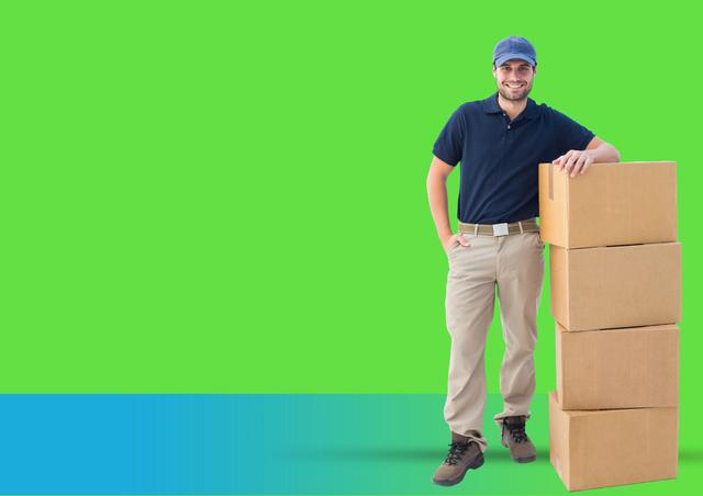 Digital composite image of confident delivery boy standing next to stacked boxes against green background