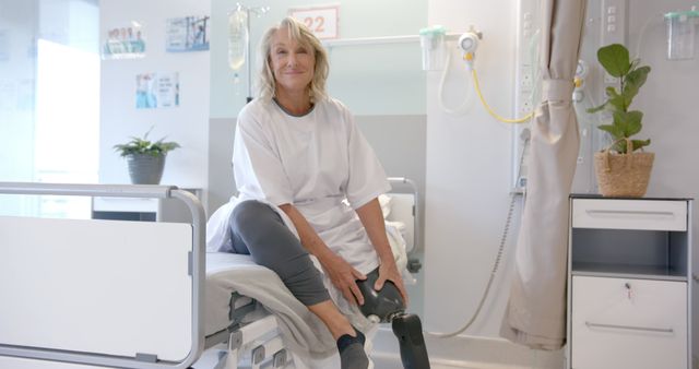 Senior Woman with Prosthetic Leg in Hospital Room Smiling - Download Free Stock Images Pikwizard.com