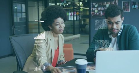 Team Reviewing Documents in Modern Office Meeting