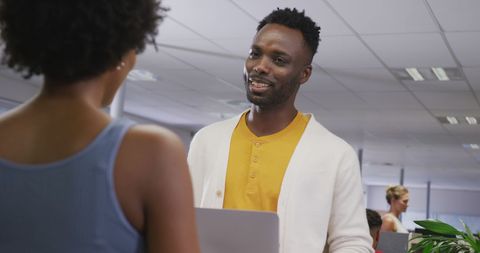 Coworkers Engaging in Productive Office Discussion