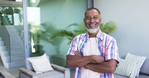 Confident Mature Man Relaxing at Home with Warm Smile - Download Free Stock Images Pikwizard.com