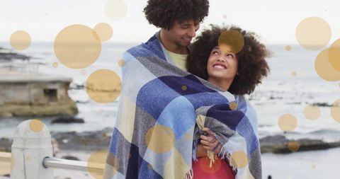 Couple Embracing Under Blanket on Coastal Beach - Download Free Stock Images Pikwizard.com