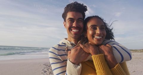Joyful Couple Embracing on Sunny Beach Leisure