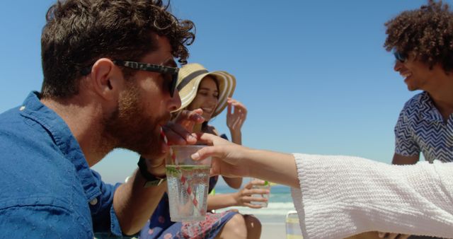 Group of Friends Sipping Refreshing Drinks at Beach - Download Free Stock Images Pikwizard.com