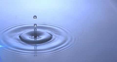 Water Droplets Creating Ripples with Soft Blue Glow - Download Free Stock Images Pikwizard.com
