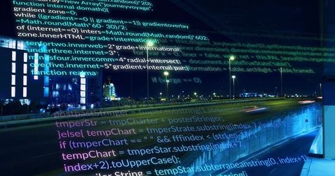 Streaming neon code overlay over urban highway at night with light trails