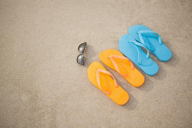 Flip flops, sunglasses and starfish in sand - Download Free Stock Photos Pikwizard.com
