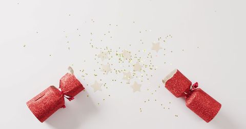 Festive Christmas Cracker with Stars and Glitter Confetti - Download Free Stock Images Pikwizard.com