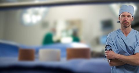 Caucasian Doctor in Hospital With Surgical Team in Background