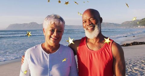 Happy Senior Couple at Beach with Stars Celebrating Love