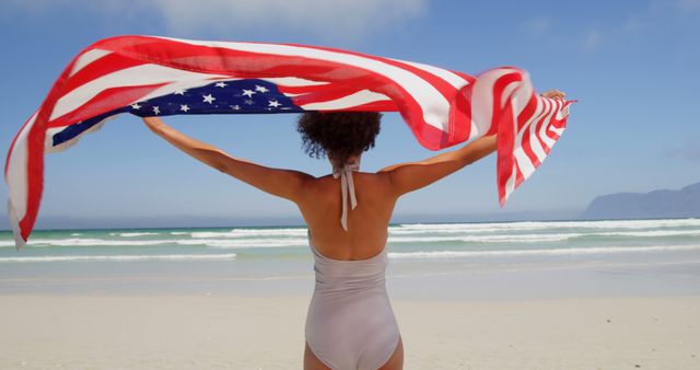 Woman Holding American Flag on Beach - Download Free Stock Images Pikwizard.com