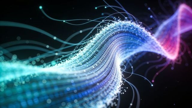 Flowing neon particle wave representing digital data stream and futuristic energy